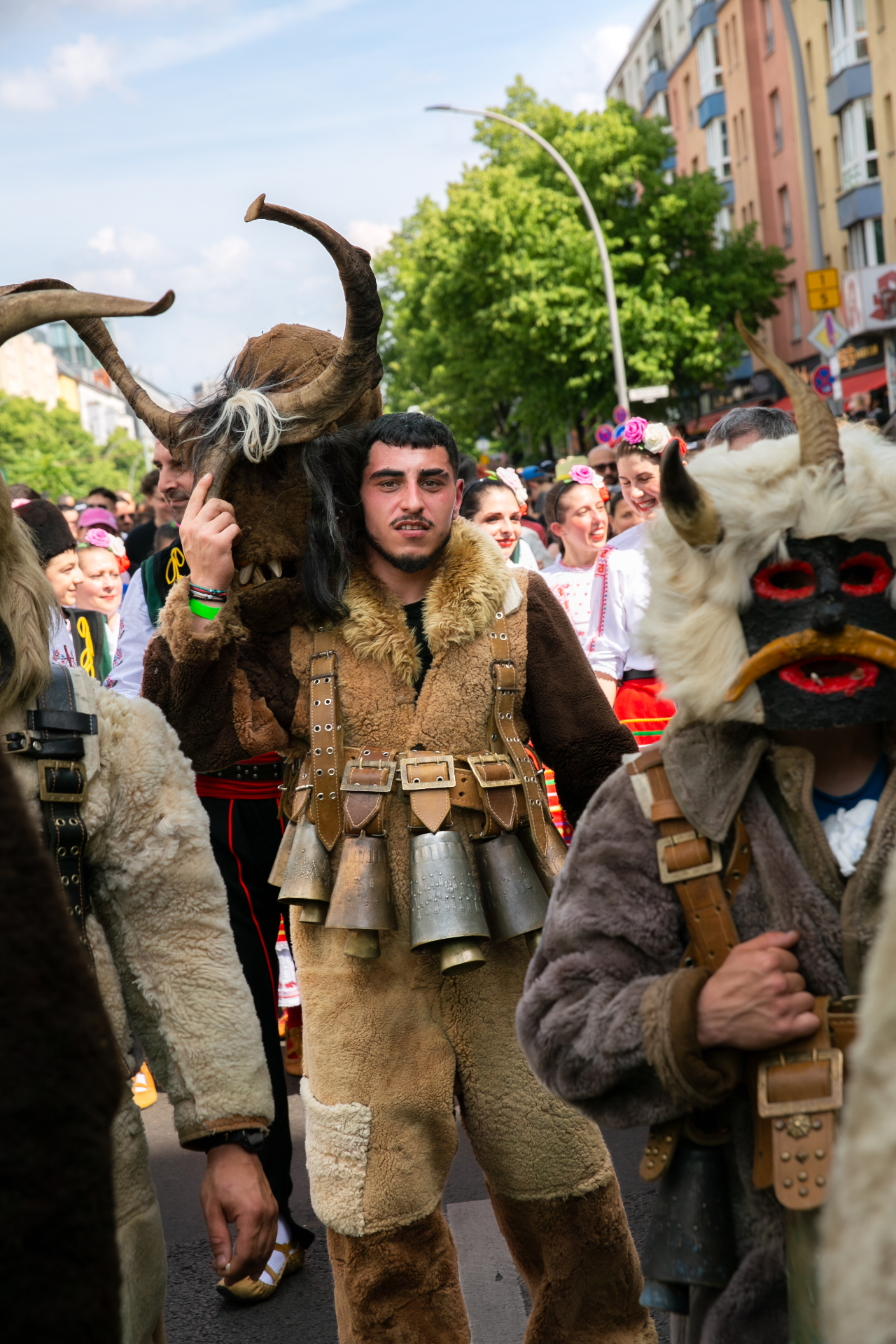 Bulgarian Kuker performers in horned masks and bells at Karneval der Kulturen Berlin